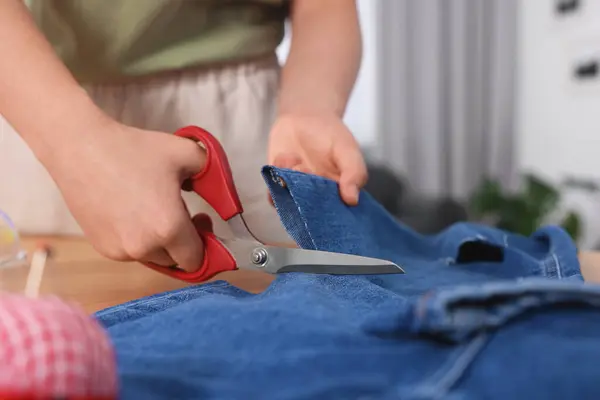 Woman Cutting Jeans Scissors Table Closeup — Stock Photo, Image
