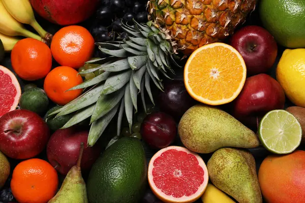 Arka plan olarak farklı olgun meyveler, üst görünüm