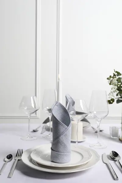 Beautiful table setting with fabric napkins indoors