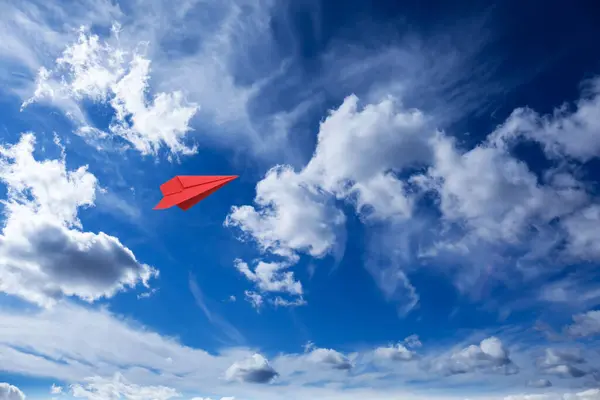 Red Paper Plane Flying Blue Sky Clouds Royalty Free Stock Images