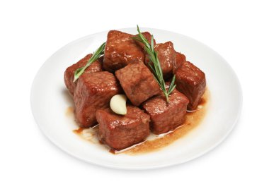 Lezzetli pişmiş biftek, sarımsak ve beyaz üzerine izole edilmiş biberiye. Lezzetli gulaş.