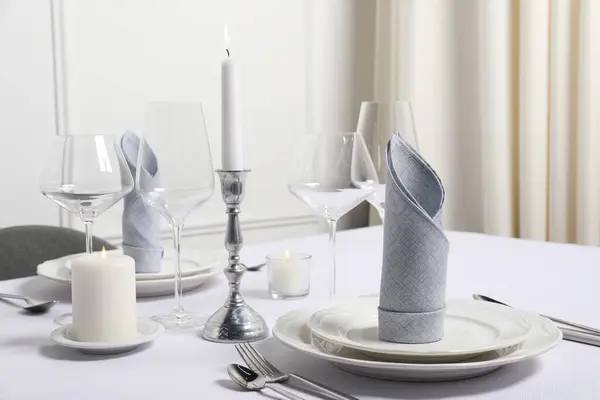 Beautiful table setting with fabric napkins indoors