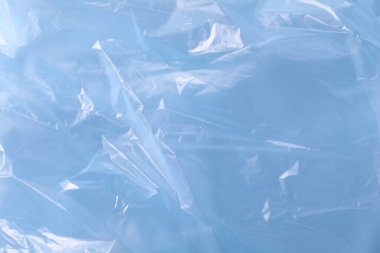 Arkaplan olarak açık mavi plastik torba dokusu, yakın plan
