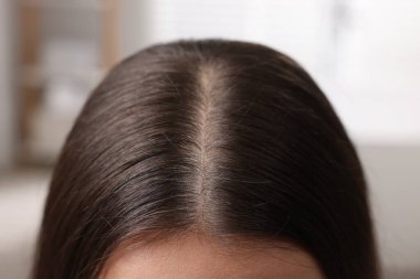 Woman with healthy hair on blurred background, closeup view clipart