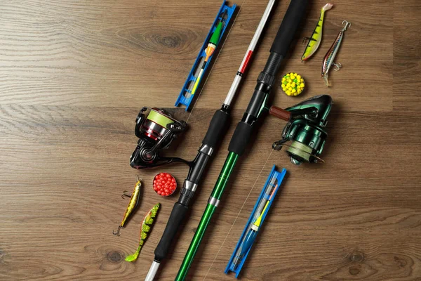 Spinning Rods Fishing Tackle Wooden Background Flat Lay — Stock Photo, Image
