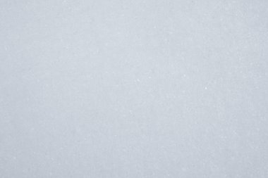 Arkaplan olarak beyaz kar, yakın plan. Kış mevsimi