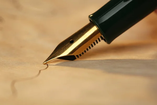 Drawing line with beautiful fountain pen, closeup