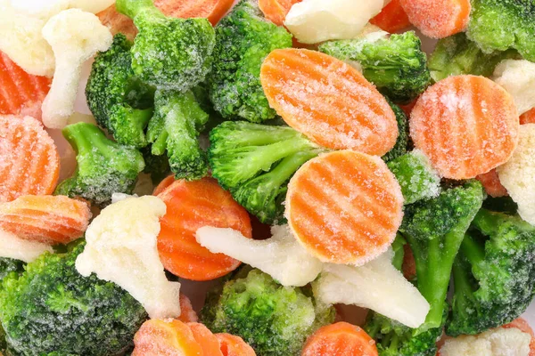 混合不同的冷冻蔬菜为背景 顶部视图 免版税图库照片