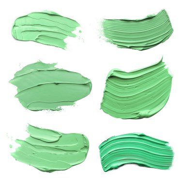 Açık yeşil boya darbeleri beyaz, üst görünümde izole