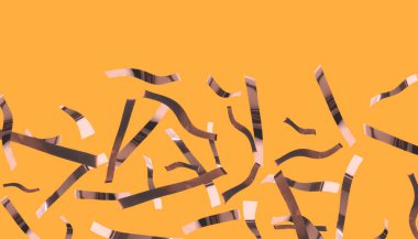 Turuncu arka plana parlak bronz konfeti düşüyor. Pankart tasarımı