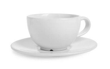 Beyaz tabağı olan seramik bardak.