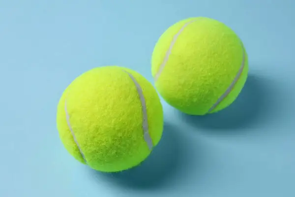 Two Tennis Balls Light Blue Background Closeup — Stock Photo, Image