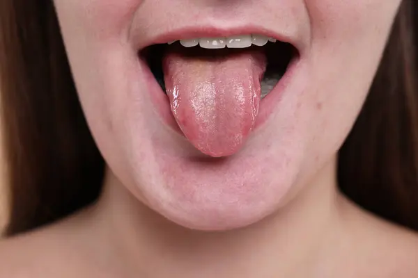 stock image Closeup view of woman showing her tongue