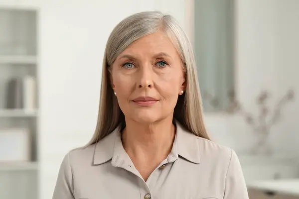 stock image Portrait of beautiful senior woman at home