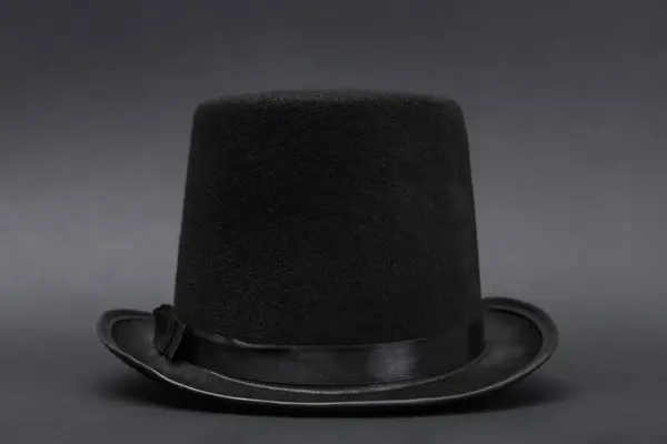 One magician top hat on dark grey background