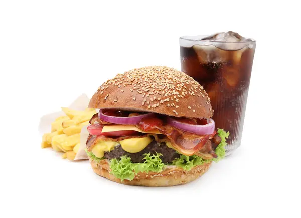 Delicious burger with bacon, soda drink and french fries isolated on white