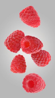 Taze olgun ahududular Gri arka planda düşüyor