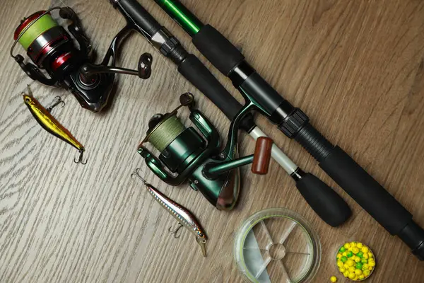 Fishing Rods Spinning Reels Baits Wooden Background Flat Lay — Stock Photo, Image