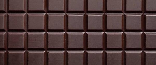 Delicious dark chocolate bar as background, closeup. Banner design