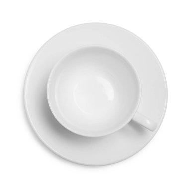 Üst görünümde beyaz üzerine izole edilmiş çay tabağı seramik fincan
