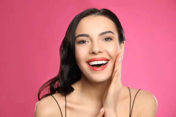 stock image Portrait of surprised woman on pink background