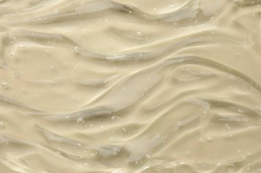 Bej arka planda kozmetik jeli temizle, üst görünüm