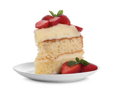 Taze çilekli lezzetli bir kek ve beyaz üzerine izole edilmiş nane.