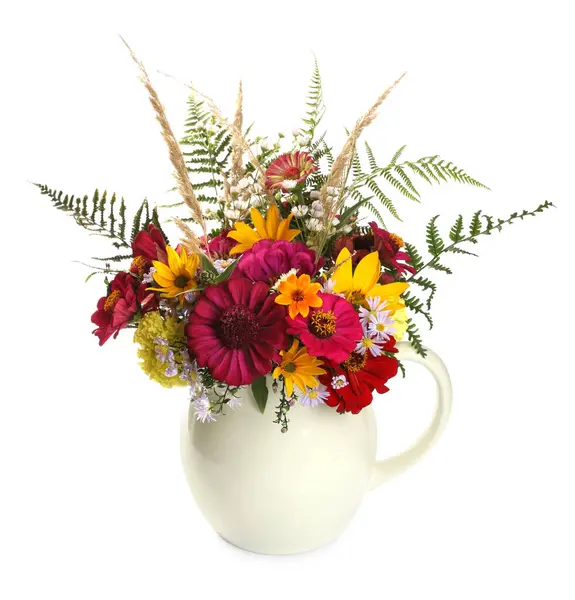 Beautiful wild flowers in jug isolated on white