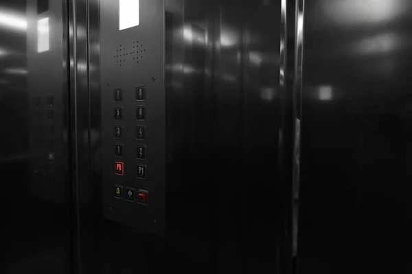 Modern metallic elevator with call button panel
