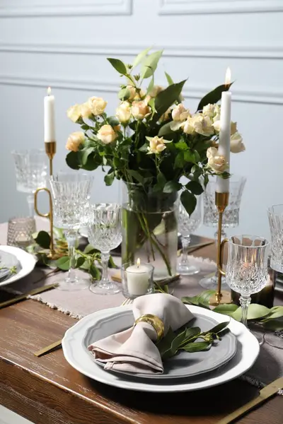 Beautiful table setting with floral decor indoors