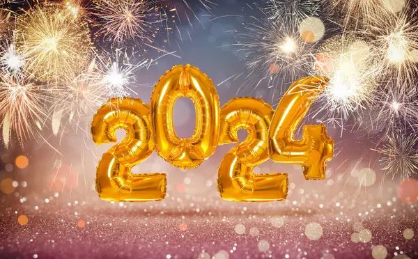 Happy New 2024 Year. Bright number shaped balloons on blurred background with fireworks
