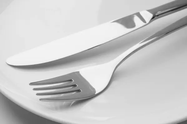 Clean Plates Fork Knife Closeup View Royalty Free Stock Images