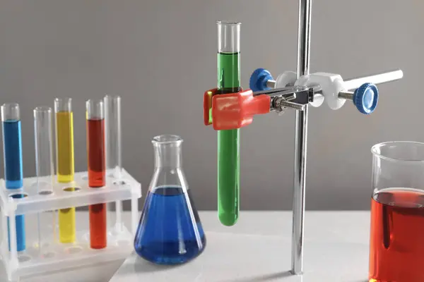 Retort Stand Laboratory Glassware Liquids Table Light Grey Background — Stock Photo, Image