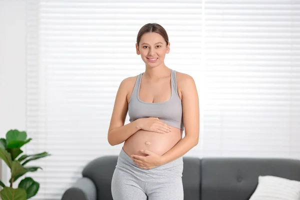 Beautiful Pregnant Woman Standing Sofa Home — Stock Photo, Image