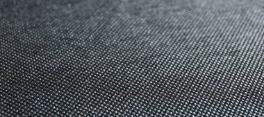 Arkaplan olarak koyu kumaşın dokusu, yakın plan