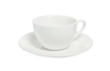 Beyaz tabağı olan seramik bardak.