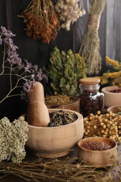 Many different dry herbs and flowers on table