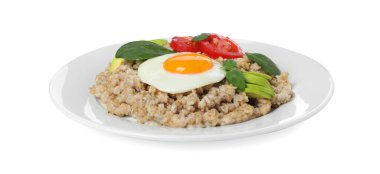 Lezzetli haşlanmış yulaf ezmesi, kızarmış yumurta, domates, avokado ve fesleğen.