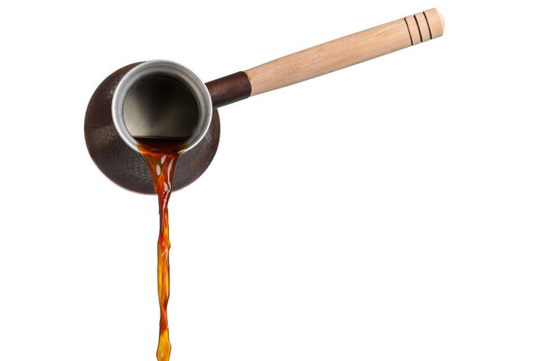 Pouring hot coffee from turkish pot on white background