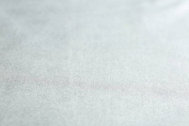 Arkaplan olarak narin beyaz kumaşın dokusu, yakın plan