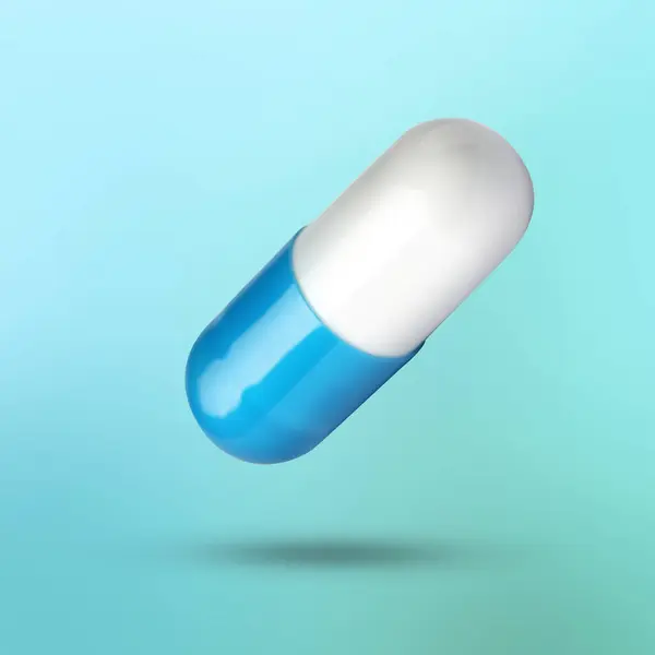 Açık Mavi Arkaplanda Havada Renkli Vitamin Kapsülü — Stok fotoğraf