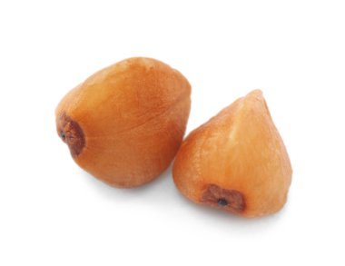 Beyaz, makro manzaralı iki karabuğday tohumu.