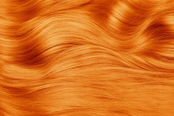 Beautiful orange hair as background, top view