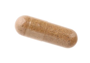 Üst görünümde izole edilmiş bir vitamin kapsülü