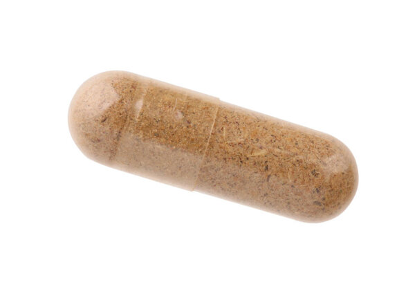 Одна капсула витамина изолирована на белом, вид сверху