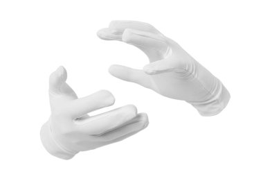 Sihirbaz beyaz arka planda bir şey tutuyor, yakın plan