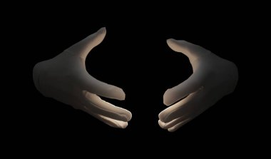 Sihirbaz siyah arkaplanda bir şey tutuyor, yakın plan.