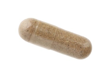 Üst görünümde izole edilmiş bir vitamin kapsülü