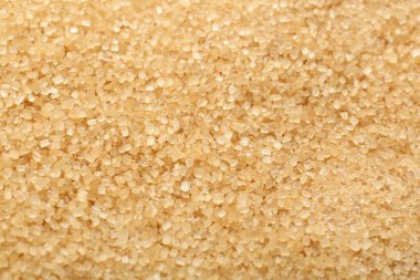 Arkaplan olarak granüle kahverengi şeker, üst görünüm
