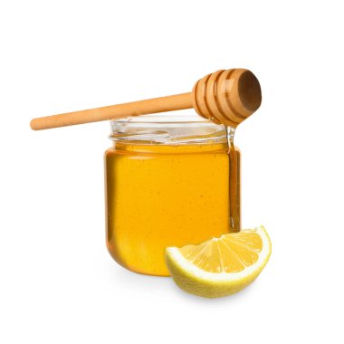 Bal cam kavanozda, limon ve balık beyazda izole edilmiş.